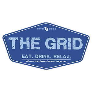 The Grid logo with light blue lettering on dark blue diamond