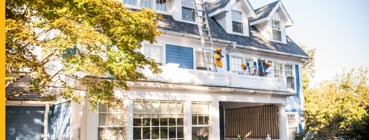 certapro painters team members painting home exterior