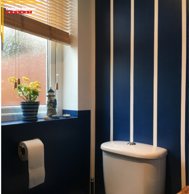 bathroom with painted striped wall